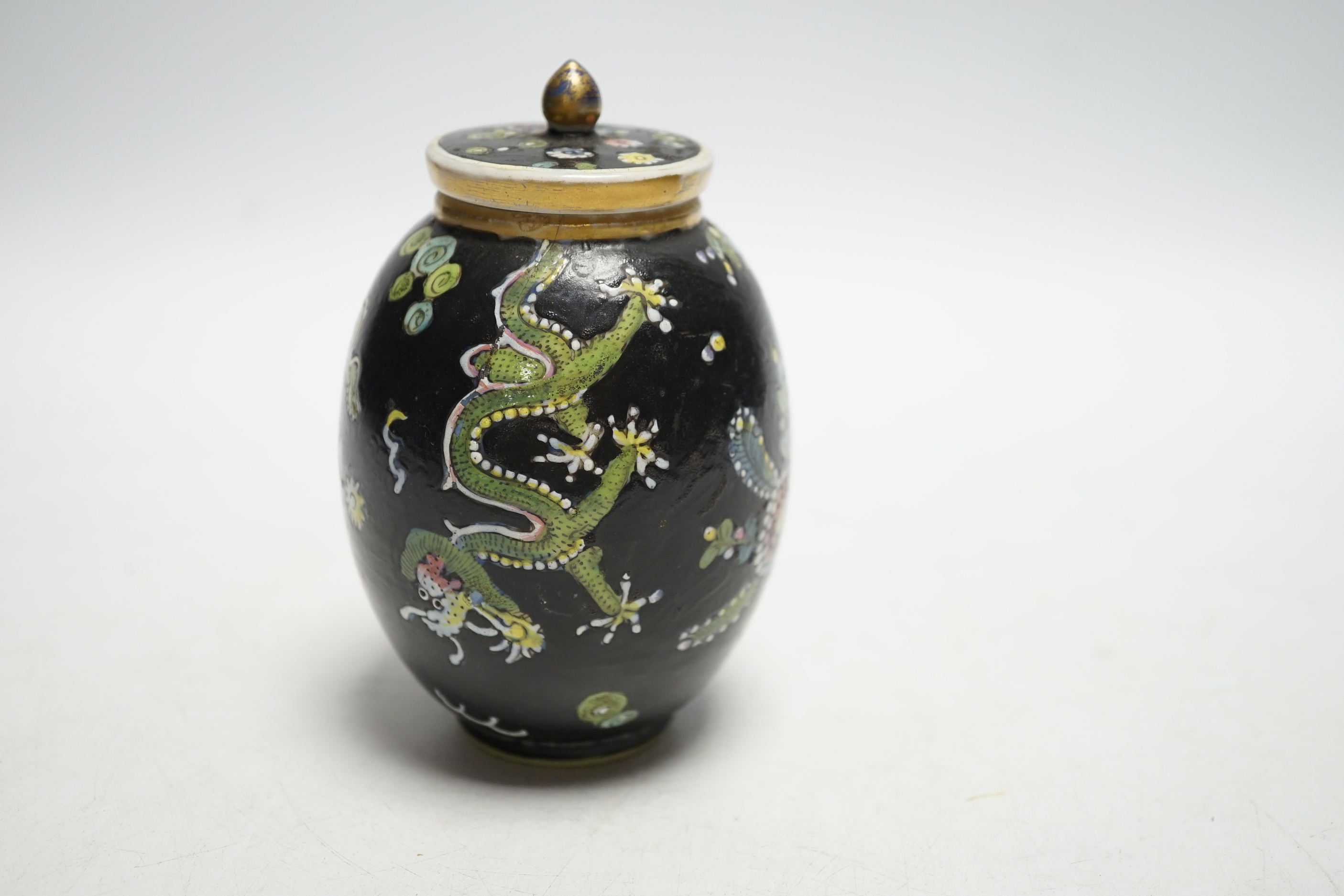 A Chinese Kangxi clobbered dragon jar and cover, 10cm high